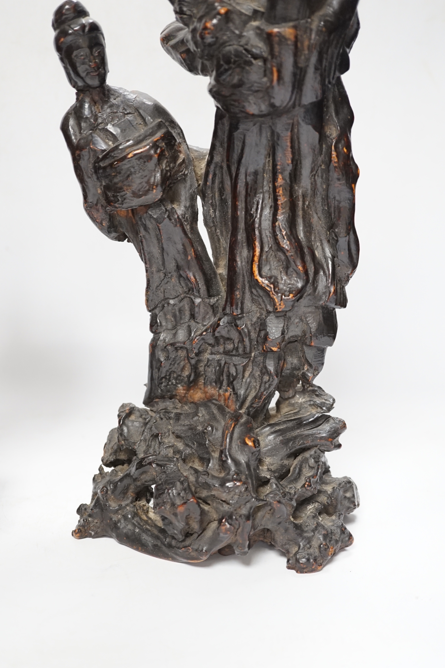 A Chinese root wood carving of two females, 42cm, and an early 20th century Chinese root carving of an immortal, on soapstone base, 36cm tall